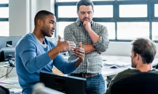 group of people discussing work in the office